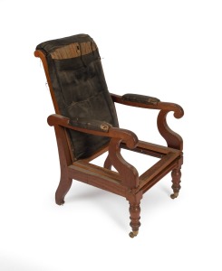 An antique Australian cedar reclining library armchair with original polish with remnants of horsehair upholstery, New South Wales origin, circa 1860, note: missing drop-in seat frame. 107cm high, 58cm across the arm.
