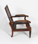 An antique Australian cedar reclining library armchair with scroll arms, splat back and triple ring turned front legs plus original brass castors, New South Wales origin, circa 1845, note: missing drop-in seat frame and back cushion frame. 89cm high, 59cm - 2