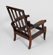 An antique Australian cedar reclining library armchair with scroll arms, splat back and triple ring turned front legs plus original brass castors, New South Wales origin, circa 1845, note: missing drop-in seat frame and back cushion frame. 89cm high, 59cm - 3