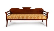 An antique Australian cedar miner's couch, mid 19th century, ​​​​​​​89cm high, 198cm wide, 60cm deep.