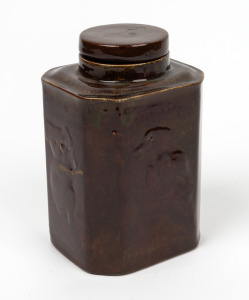 An Australian pottery brown glazed tea canister with kangaroo, koala, kookaburra and emu decoration, in the manner of the Bushells "Australian Animals" tin, 16cm high