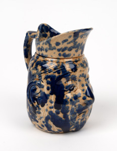 BENDIGO POTTERY face jug with unusual mottled blue glaze, ​​​​​​​15cm high.