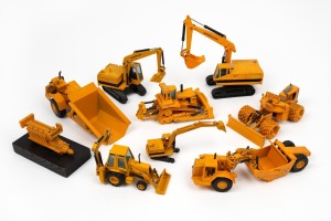 CATERPILLAR TRACTORS, DIGGERS & EARTH MOVERS: A box containing a collection of scale models, believed to be part of the salesman's kit. (9 different items).