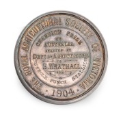 DEPARTMENT OF AGRICULTURE VICTORIA, The Royal Agricultural Society of Victoria, 1904, Champion Prize of Australia, medal in silver (48mm, 55g, by K.G. Luke); reverse inscribed to "S. WRATHALL" for "SUFFOLK PUNCH - STALLION". A rare and beautiful medal.
