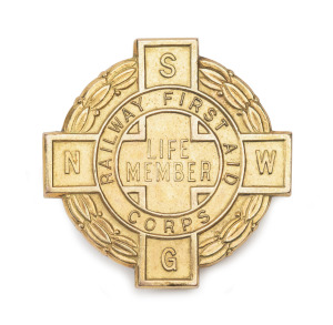 New South Wales Railway First Aid Corps Life Member badge in 9ct gold engraved "J.F. BONE 1958", 10 grams total including brass screw back.