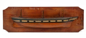 "AZTEC" half hull model boat, pine and marine ply with painted decoration and inscriptions "AZTEC SUNK BY FIRE, POOLE, 1904", 22 x 69cm.