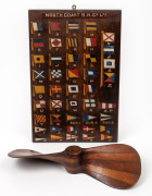 NORTH COAST S.N.Co. LTD. hand-painted signal flag board display, together with a cedar and pine pattern makers boat propeller, (2 items), both with inscriptions. the board 46 x 31cm overall.