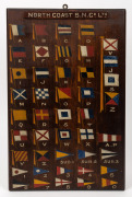 NORTH COAST S.N.Co. LTD. hand-painted signal flag board display, together with a cedar and pine pattern makers boat propeller, (2 items), both with inscriptions. the board 46 x 31cm overall. - 2