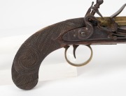An antique English flintlock pocket pistol with early New Zealand Maori carved stock, late 18th century, 23cm long. - 2