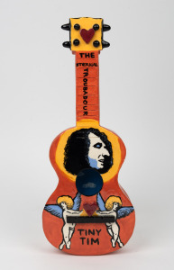 ANDREW RAYNOR "The Eternal Troubadour" Tiny Tim wall mounted ceramic ukelele, signed and titled verso, dated '98, 39cm high overall