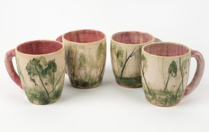 ARTHUR MERRIC BOYD and NEIL DOUGLAS set of four pottery mugs with hand-painted landscape scenes, pink interior and pink handles, incised "A. M. B." and signed "Neil Douglas, Australia", 10cm high