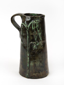 ANNIE MITCHELL green glazed pottery jug with applied gumnuts and leaves, incised "A. F. Mitchel, Sth. Aus.", ​​​​​​​18cm high.