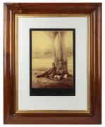 J. W. LINDT large format sepia tone photograph of two swagmen sitting beneath a tree, mounted on original card, stamped "J. W. Lindt, Melbourne", attractively displayed in an Australian cedar frame, sheet size 34 x 25cm, 71 x 58cm overall.