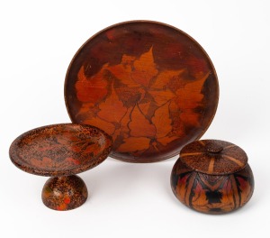 A pokerwork lidded box, comport and platter, circa 1920s, (3 items), the platter 23.5cm diameter