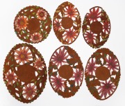 Six assorted hand-painted and cut leather doilies, circa 1920/30s, the largest 46cm wide