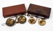 Two antique gold scales in timber cases, 19th century, the larger 21cm wide