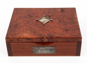 V.R.C. SPRINT CLASSIC, FLEMINGTON, 10th NOVEMBER 2018: Australian red gum presentation box adorned with silver plaque and decoration, bearing maker's label to base "Peter Gertler, Gold & Silversmith", 19.5cm wide