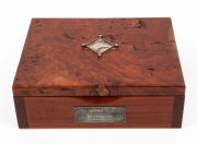 V.R.C. SPRINT CLASSIC, FLEMINGTON, 10th NOVEMBER 2018: Australian red gum presentation box adorned with silver plaque and decoration, bearing maker's label to base "Peter Gertler, Gold & Silversmith", 19.5cm wide