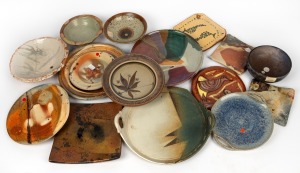 Sixteen assorted studio pottery platters and bowls, the largest 33cm wide