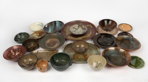 AUSTRALIAN STUDIO POTTERY: Including brown glazed plates, platters, bowls and dishes, also including some Japanese examples, various makers, (23 items), the largest 35cm diameter&nbsp;