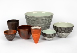 Seven assorted Australian ceramic pottery bowls and vases, mostly adorned with linear decoration in black, white and brown, the largest signed "B. Kemp, 2000", the Kemp 20cm high, 28cm wide