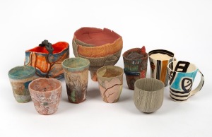 Art pottery and ceramic beakers, teacups, vase and basket vase, makers include CLARE UNGER and JUDY LANE (10 items), the largest 16cm high.