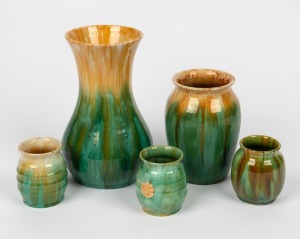 JOHN CAMPBELL five assorted green and yellow glazed pottery vases, all incised "John Campbell, Tasmania" and one example bearing original foil label, the largest 22cm high