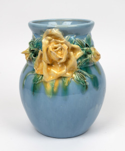 Blue glazed pottery vase with applied yellow rose decoration, incised signature to base "VLETTA" most likely Daisy Merton, 22cm high.