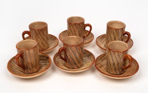 CARL COOPER set of six coffee cups and saucers with cross hatched linear decoration, incised signature to base of each piece, the saucers 11cm diameter.