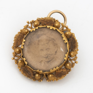 An antique 18ct gold pendant housing a somewhat faded photo portrait, early to mid 19th century, ​​​​​​​2.5cm high, 3.7 grams.