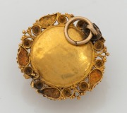 An antique 18ct gold pendant housing a somewhat faded photo portrait, early to mid 19th century, ​​​​​​​2.5cm high, 3.7 grams. - 2