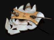 An antique mother of pearl brooch in 9ct gold mount, circa 1900, ​​​​​​​3.5cm high, 4.3 grams total. - 2