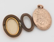 An antique 9ct gold locket with engraved decoration, circa 1900, ​​​​​​​3.3cm high overall, 8.9 grams total including non gold elements. - 2