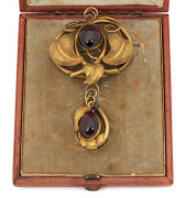 An antique Australian gold and polished garnet brooch and matching pendant in original fitted case, 19th century, ​​​​​​​16.7 grams total including stones.