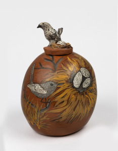 LINDY RONTJI Hermannsburg pottery lidded vase with hand-painted bird decoration and bird finial, signed to base; together with a book "HERMANNSBURG POTTERS" by Jennifer Isaacs, (2 items), the vase 31cm high.