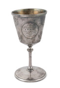 An antique silver plated trophy goblet with engraved decoration and vignette of a female tennis player, engraved "MR LOCKE'S CUP Presented To A.Y. ROSS, Winner Of Most Events, S. ANDREW'S DAY, 1884, GISBORNE, N.Z.", 16cm high. - 2