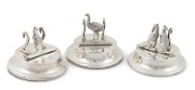 A set of three antique sterling silver place name holders with kangaroo and emu decoration, made in Birmingham, circa 1905, ​​​​​​​3cm high, 4cm diameter.