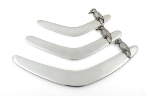 Three Australian silver boomerang letter openers with applied kookaburra decoration, 20th century, the largest 18cm long, 103 grams total.