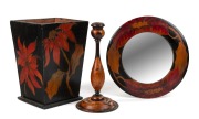 Australian pokerwork candlestick, framed mirror and wastepaper basket, circa 1920s, (3 items), the mirror 30cm diameter.