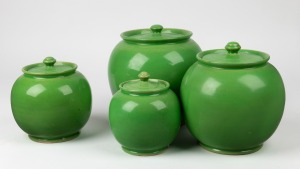 BENDIGO POTTERY set of four canisters with apple green glaze, the largest 20cm high, 18cm wide.