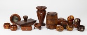 Seventeen assorted pieces of Australian blackwood and huon pine treen ware and pokerwork, including napkin rings, inkpot, vase and souvenir dish (with silver maps of Tasmania), etc. Mostly early 20th century, the vase 14cm high.