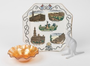 "ADVANCE AUSTRALIA" Federation porcelain plate, circa 1885, stamped "Designed By G. Hodgson. Jun. & Co. Summer Hill, Rd. No. 29565", a carnival glass "SHRIKE" bowl and a Hungarian white porcelain kangaroo statue, 19th and 20th century, (3 items), the plate 24cm wide.