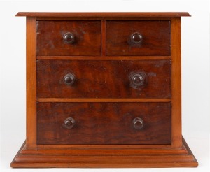 An antique Australian cedar and kauri pine miniature four drawer chest with red pine secondaries, 19th/20th century, 32cm high, 39cm wide, 26cm deep