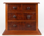 An antique Australian cedar and kauri pine miniature four drawer chest with red pine secondaries, 19th/20th century, 32cm high, 39cm wide, 26cm deep