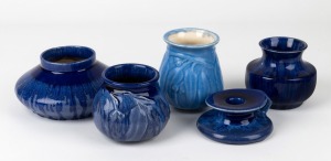 MELROSE WARE four assorted blue glazed pottery vases (two with gum leaf decoration); together with a rare candle holder, (5 items), the largest 10.5cm high