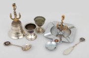 Assorted silver plated maritime related tableware comprising of "M.V. KANIMBLA" bell, "T.S.M.V. MANOORA" ashtray, "HUDDARD PARKER M.V. WESTRALIA" eggcup, "R.M.S. ORFORD" eggcup, "S.S. ORONTES" pate knife, "S.S. OTRANTO" sifting spoon and a stainless steel