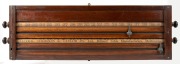 An antique Australian blackwood wall mounted billiard scoreboard, manufactured by Alcock, Thompson & Taylor of Melbourne, 19th century, 29cm high, 95cm wide.