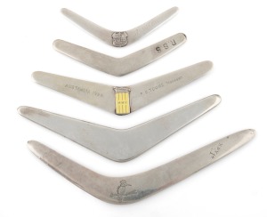 Four Australian silver boomerang letter openers, makers and retailers include ANGUS & COOTE, PALFREY, HARDY BROS. and FLAVELLE, 20th century, the largest 17cm long, 135 grams total.