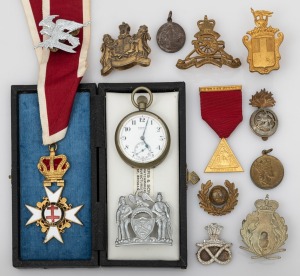 A Sovereign Military Hospitaller Order Of Saint John Of Jerusalem medal on neck ribbon in original box presented to I.G. HINGST; together with and antique Swiss pocket watch and a group of assorted military related medallions, badges and hat badges, mixed