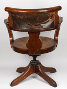 An antique Australian Tasmanian blackwood captains chair with cane seat, leather upholstered back rest and arms and original adjustable swivel mechanism, circa 1890, formerly part of the furnishings of Parliament House, Hobart, Tasmania, 90cm high, 70cm a - 3